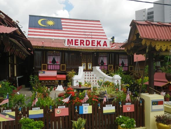 Wooden house of Melaka with the Malaysian flag painted on the roof