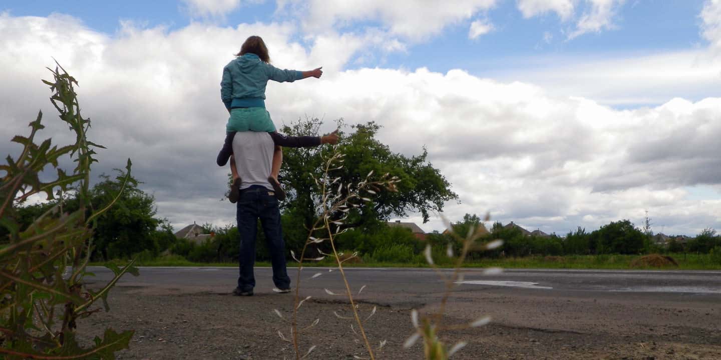 Hitchhiking on the road with a backpack