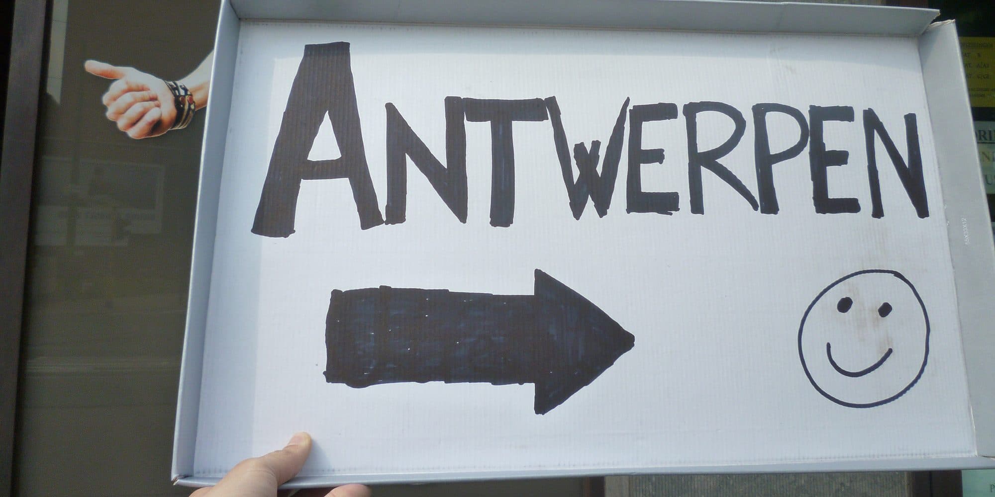 Hitchhiking — thumb out on the road