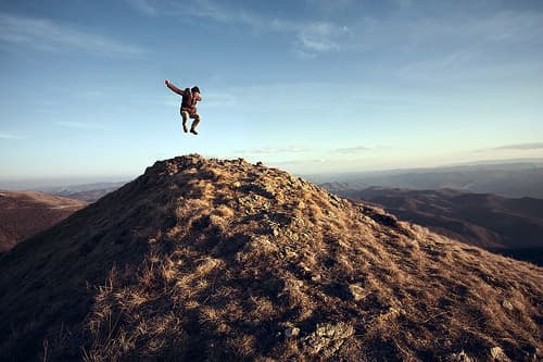 Jumping on a mountain summit