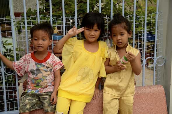 Vietnamese children waving at us in the streets of Ha Tien