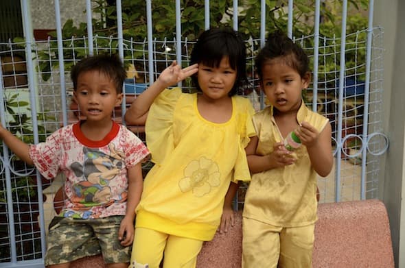 Vietnamese children waving at us in the streets of Ha Tien