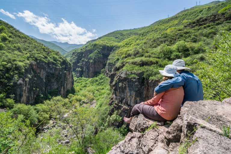 Pablo and Ilze on overviewing the mountain view and river in Armenia