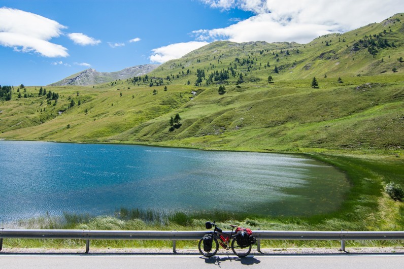 Peaceful lake after a long climb in the Alps